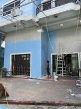 The boys helping re-paint the centre