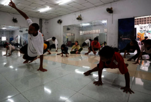 French volunteer, Amaury Mayaya teaching dance