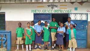 Orphan children back from School