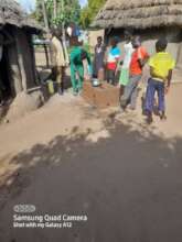 Refugees with fuel efficient cookstove