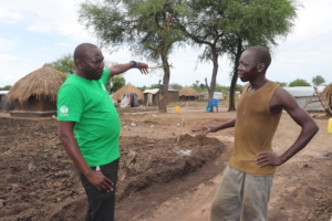 Our coordinator talking with a beneficiary
