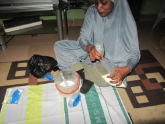 Zainab making yogurt