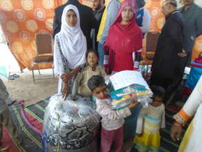 new clothes and blanket to children and family