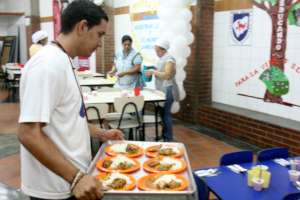 Teachers helping to layout the tables for lunch