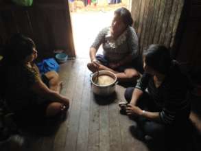 Women cooking plant-based medicine.