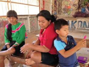 Carolina and her son attending patients