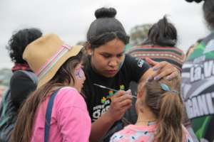 Teens paint faces