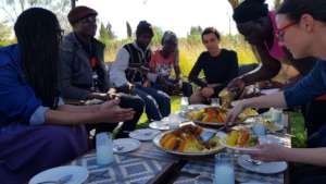 Eating couscous (a traditional Moroccan dish)