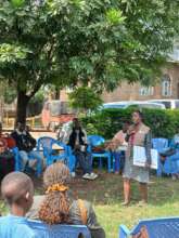 A community Facilitator supporting a group discuss