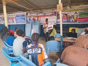 Children in the community engeged in a discussion.