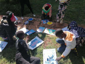 Children participating in play and art therapy