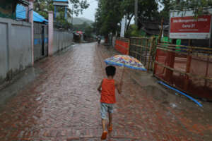 running to take shelter in a Rohingya Refugee Camp