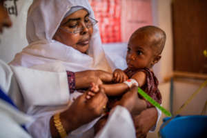 Treating a malnourished child in Somalia