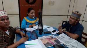 Jeiser, Ketty, and Percy taking calls to the radio