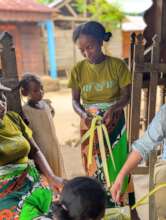 Local artisan trainees process raffia palm fiber