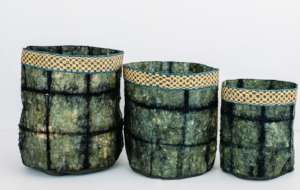 Team designed cocoon silk baskets with raffia trim