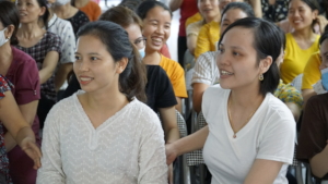 Workers watching a communications session