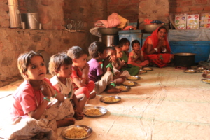 Children praying before having nutritious meal.