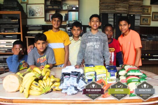Orphans Receiving Food and Supplies from SAI