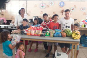 Happy children with the food that was donated