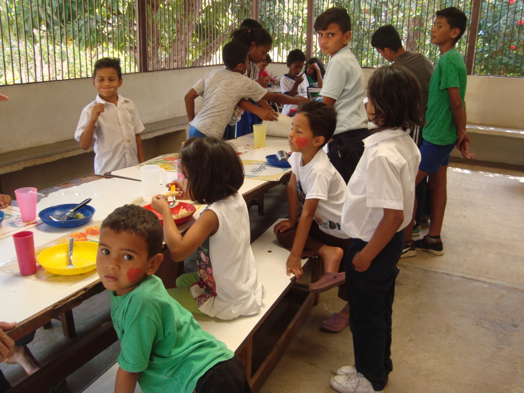 SAI supported orphan children enjoy lunchtime!
