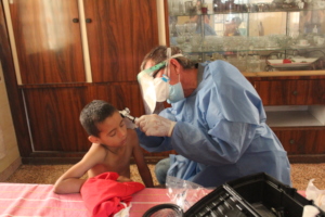 SAI Medical Assistant Examines An Orphan Boy.