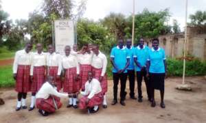 Students and staff: hearts touching