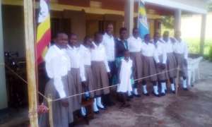 Director takes photo with a staff and girls