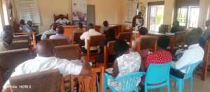 FAWE representative in presents the programme