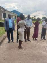 A staff KIFA receiving a cerificate of completion