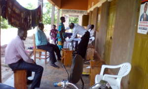 Girls taking measurement of their uniform