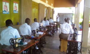 Girls attend lesson of computer skills