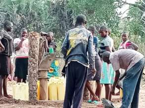 Girls & Community at the Borehole after repair