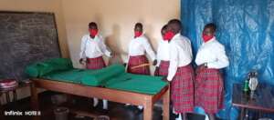 Girls backed in classroom