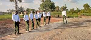 The youth inspect their work waiting for next step