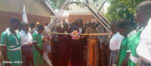 Pupils and students of KIFA line up to welcome him