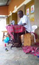 KIFA Tailor busy working on the uniform