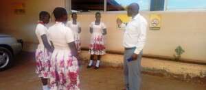 Manager of the oil mill company talks to girls