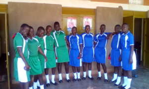 Girls display a number of their uniforms