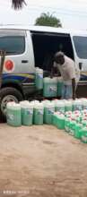 Liquid soap being packed in Institute's vehicle