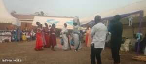 A bride and Matron carrying gifts to groom