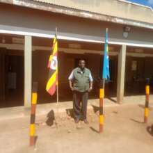 Standing between the country's flag: Respect given