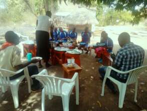 Staff share meals with their students at KIFA