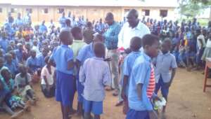 Team of KIFA, staff & children of Angic P.7 school