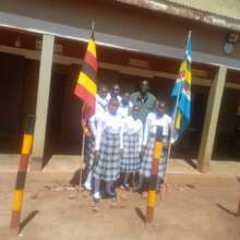 Girls pose for a photo with their new uniforms