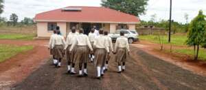 Girls outdoors searching facts: Kole District