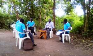 Staff in a meeting with project leader