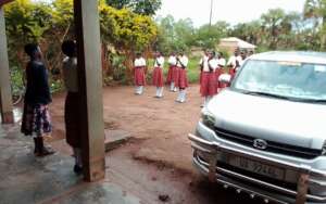 Students and staff welcome the DCDO at KIFA