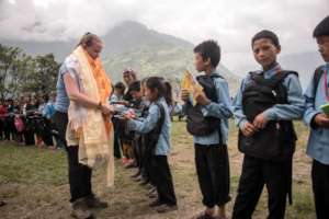 Ellie Raymond donating school bags & supplier