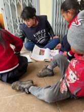 Volunteer tutoring the Street Children
